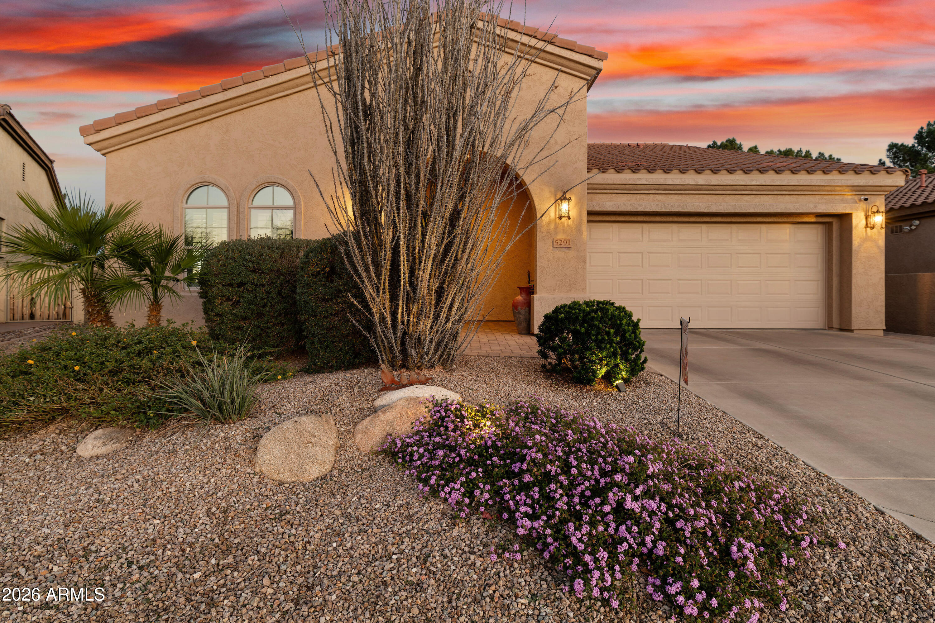 5291 South Sugarberry Court Gilbert, AZ 85298 - Photo 2 of 67 a view of a back yard of the house