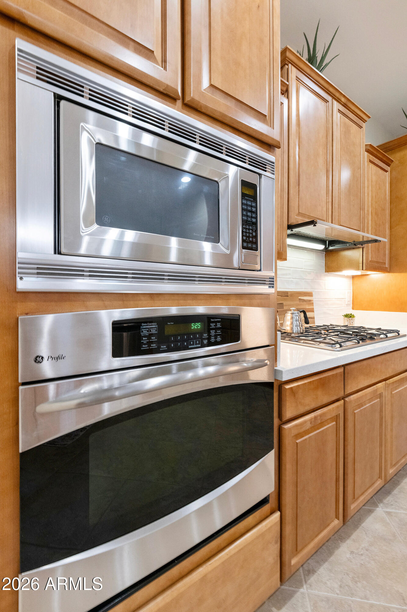 5291 South Sugarberry Court Gilbert, AZ 85298 - Photo 22 of 67 a stove top oven sitting inside of a kitchen