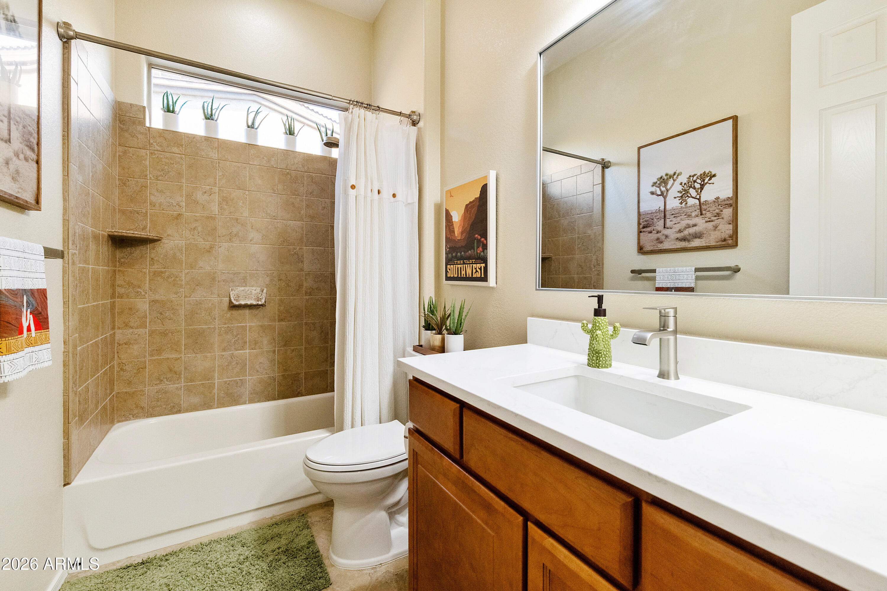 5291 South Sugarberry Court Gilbert, AZ 85298 - Photo 25 of 67 a bathroom with a sink a toilet and shower
