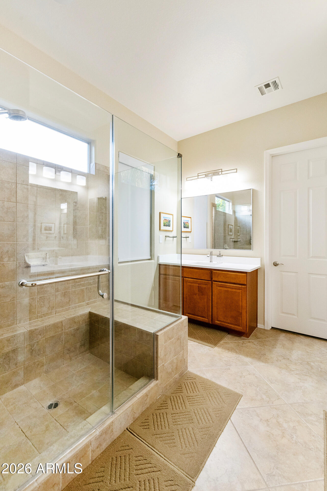 5291 South Sugarberry Court Gilbert, AZ 85298 - Photo 26 of 67 a bathroom with a tub a mirror and a shower