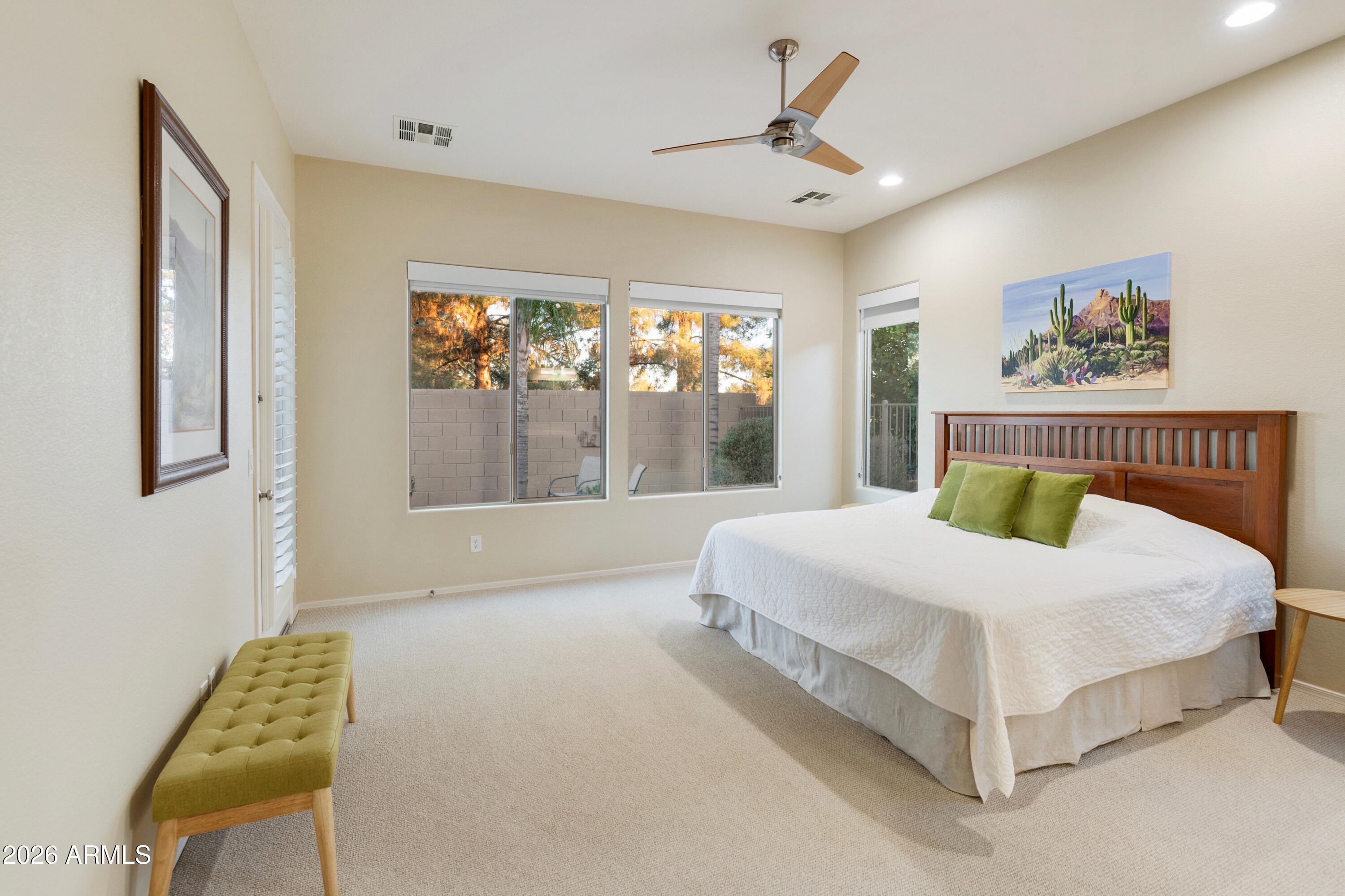 5291 South Sugarberry Court Gilbert, AZ 85298 - Photo 33 of 67 a large bed sitting in a bedroom next to a window