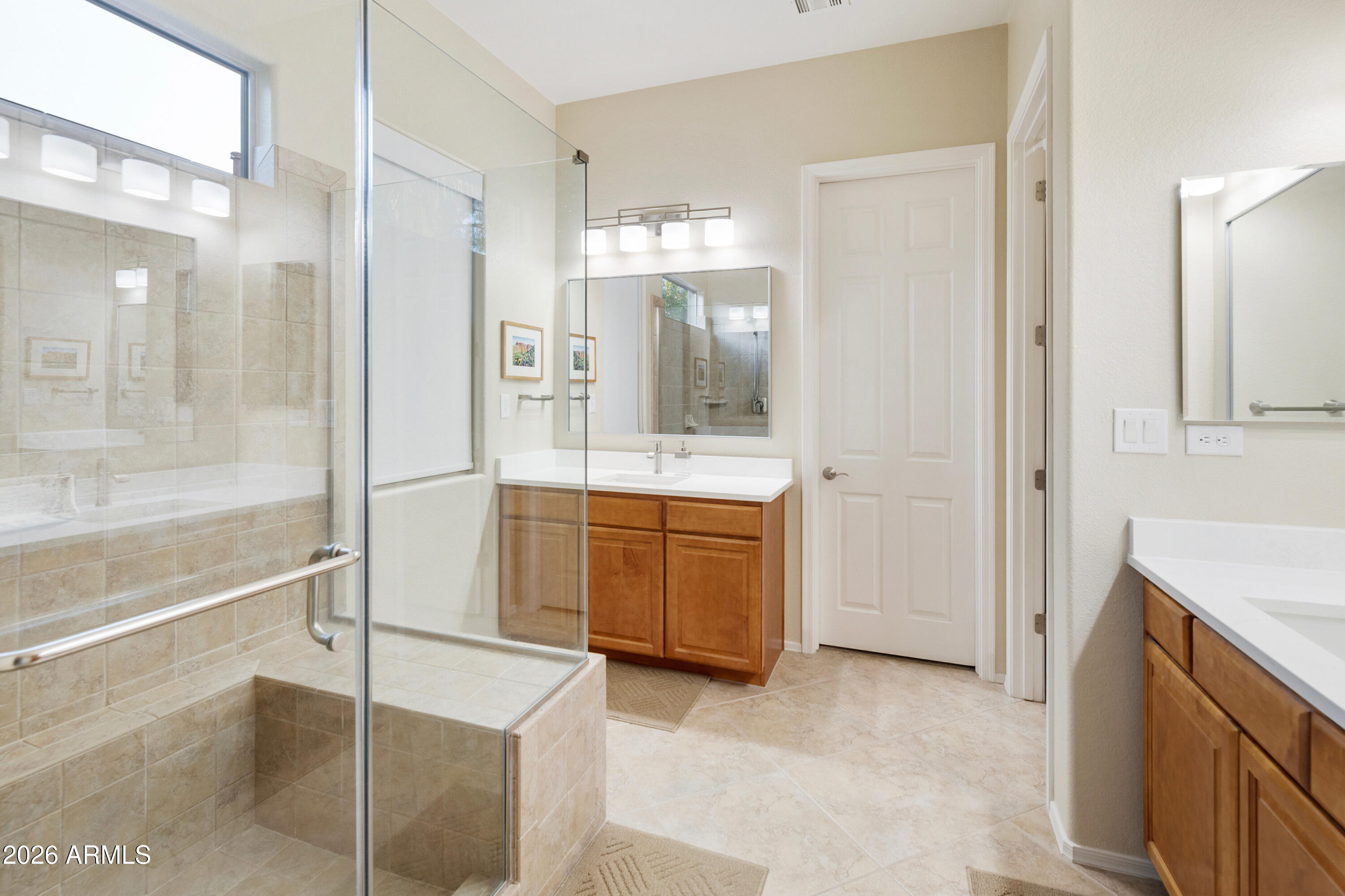 5291 South Sugarberry Court Gilbert, AZ 85298 - Photo 35 of 67 a bathroom with a double vanity sink a mirror and a shower
