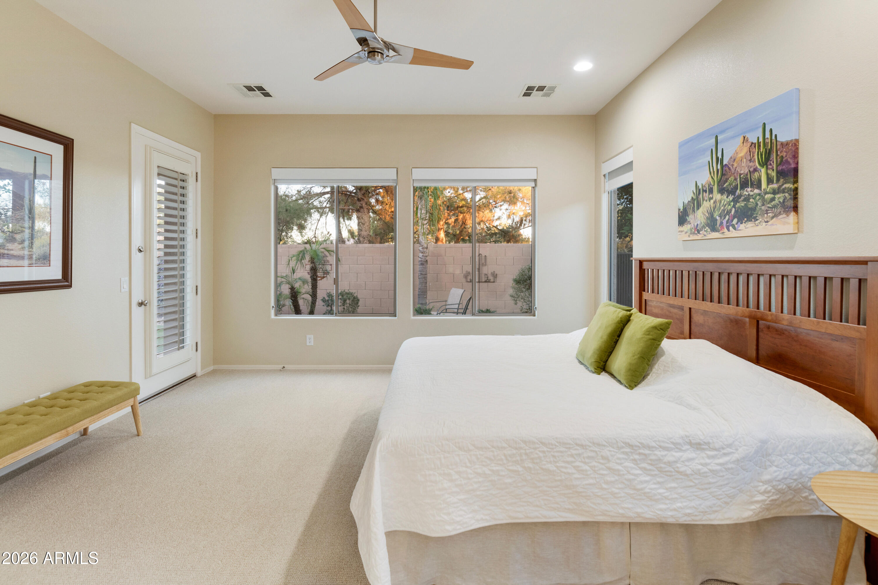 5291 South Sugarberry Court Gilbert, AZ 85298 - Photo 36 of 67 a bedroom with a bed a couch and a window