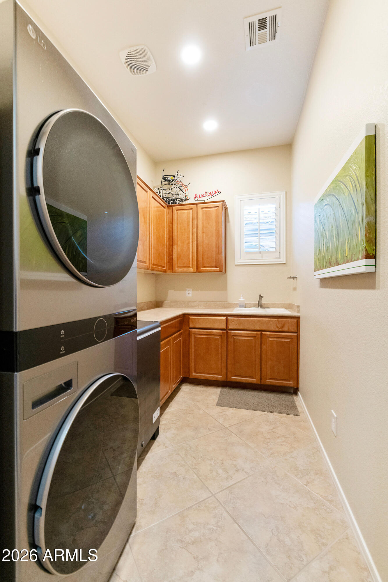 5291 South Sugarberry Court Gilbert, AZ 85298 - Photo 37 of 67 a bathroom with a sink a mirror and a toilet