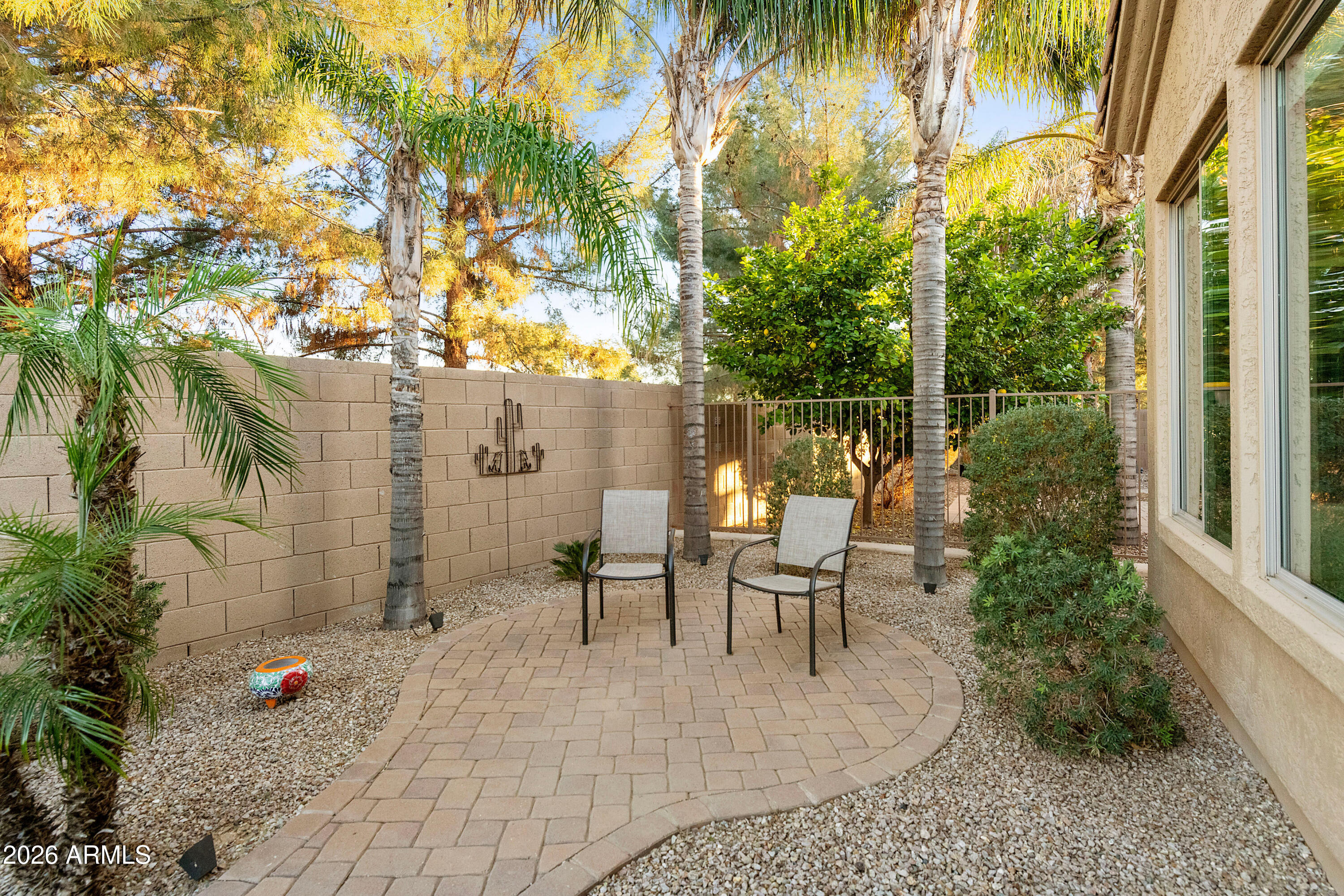 5291 South Sugarberry Court Gilbert, AZ 85298 - Photo 42 of 67 a view of a patio with table and chairs and potted plants