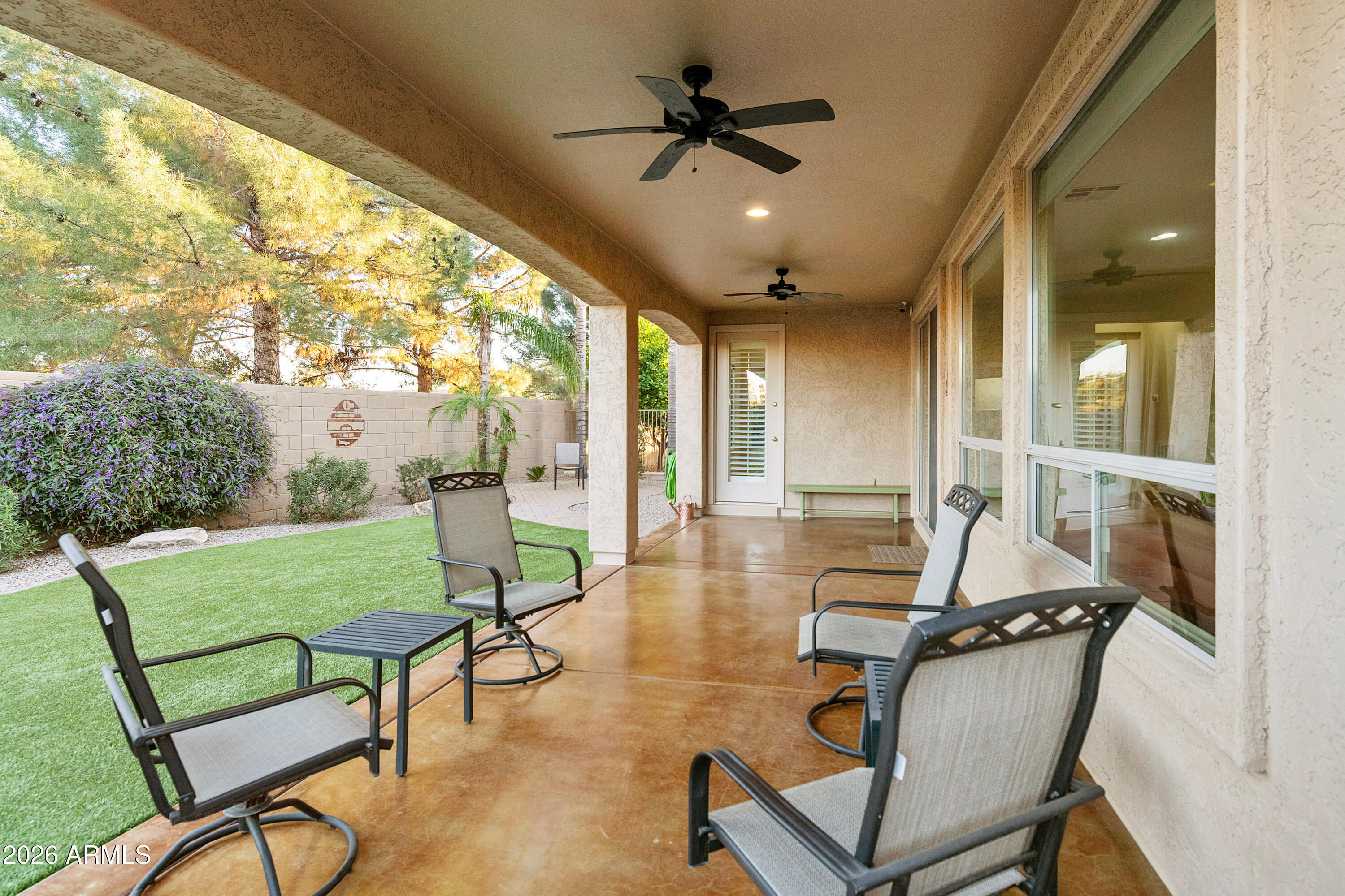 5291 South Sugarberry Court Gilbert, AZ 85298 - Photo 46 of 67 a room with lots of furniture and a chandelier