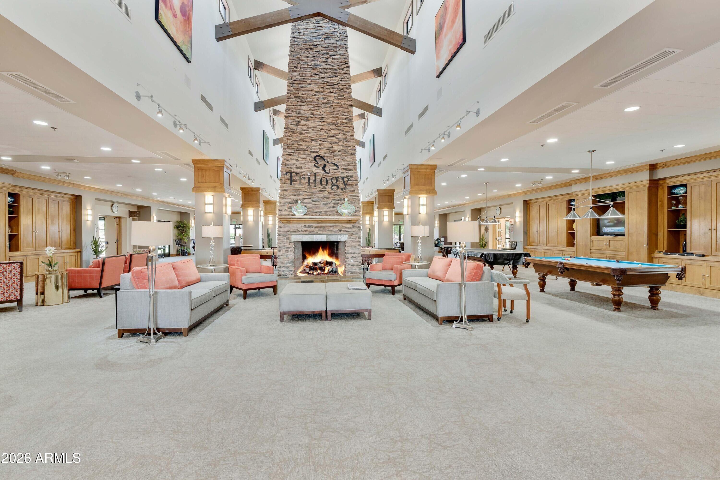 5291 South Sugarberry Court Gilbert, AZ 85298 - Photo 48 of 67 a living room with furniture and a chandelier
