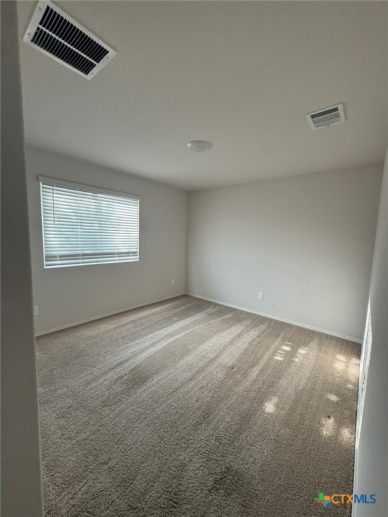 208 Ida Loop Seguin, TX 78155 - Photo 7 of 16 an empty room with windows