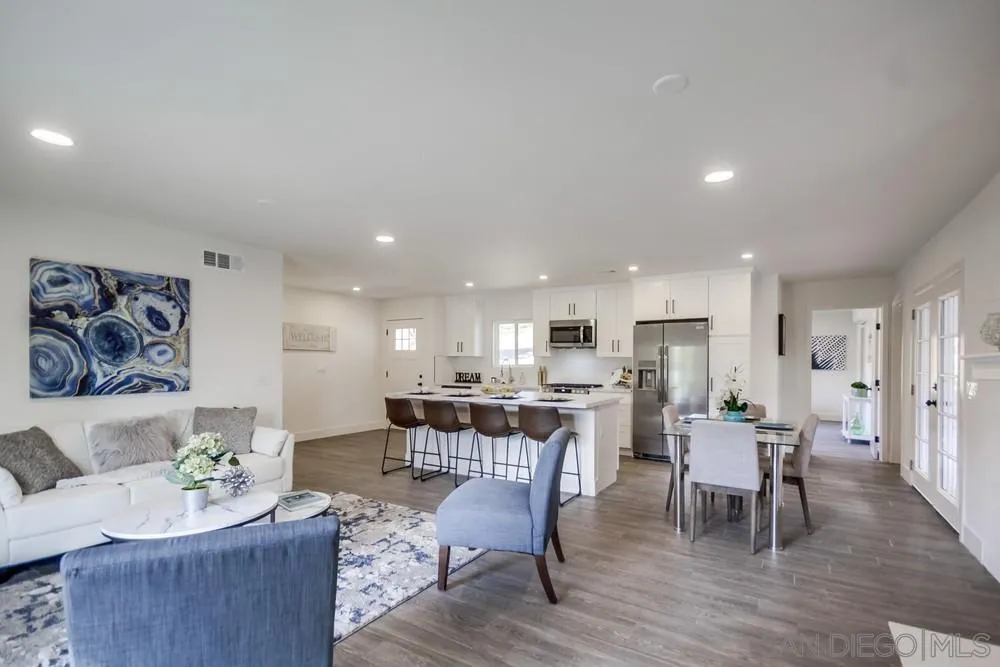 344 Mountain View Road El Cajon, CA 92021 - Photo 11 of 38 a living room with furniture and kitchen view with wooden floor