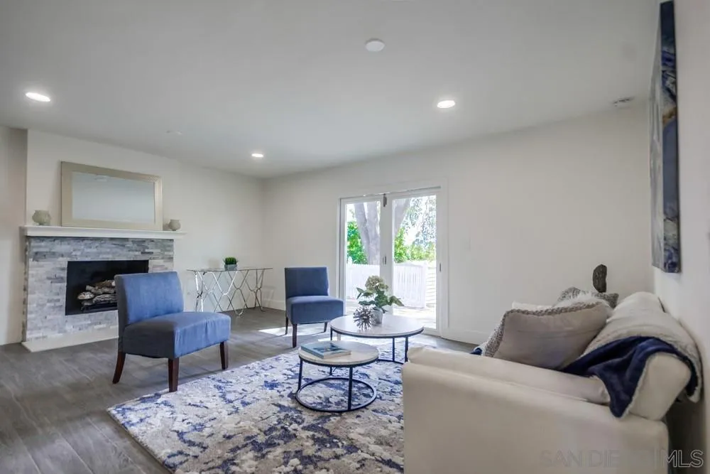 344 Mountain View Road El Cajon, CA 92021 - Photo 12 of 38 a living room with furniture and a fireplace