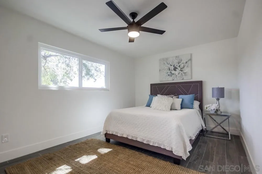 344 Mountain View Road El Cajon, CA 92021 - Photo 19 of 38 a bedroom with a bed and a window