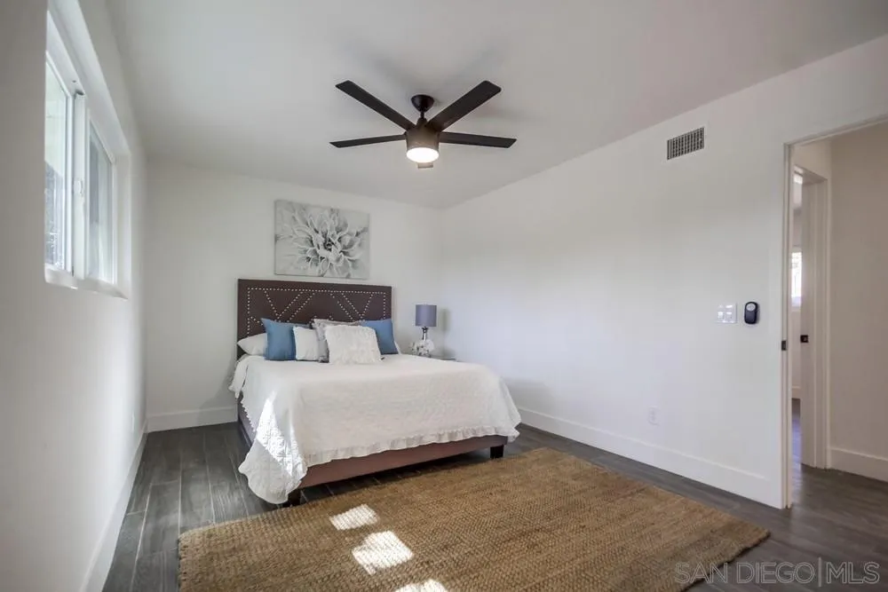 344 Mountain View Road El Cajon, CA 92021 - Photo 21 of 38 a bedroom with a bed and a window