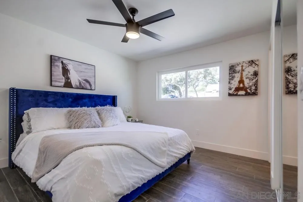 344 Mountain View Road El Cajon, CA 92021 - Photo 23 of 38 a bedroom with a large bed and a window
