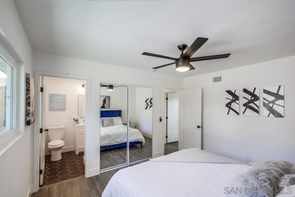 344 Mountain View Road El Cajon, CA 92021 - Photo 24 of 38 a bedroom with a bed and a chandelier