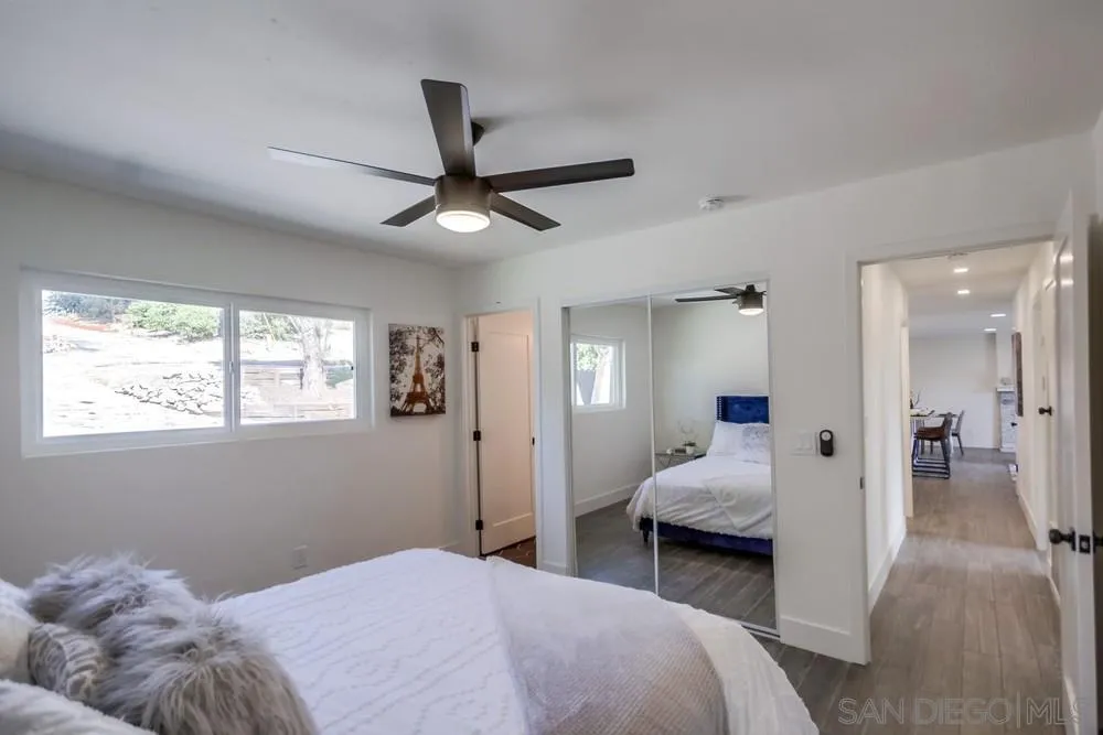 344 Mountain View Road El Cajon, CA 92021 - Photo 25 of 38 a bedroom with a bed and a large mirror