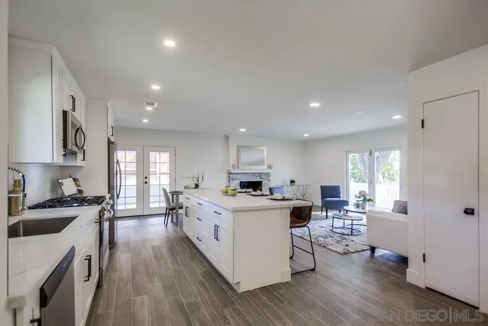 344 Mountain View Road El Cajon, CA 92021 - Photo 3 of 38 a kitchen with a stove a sink a refrigerator and cabinets