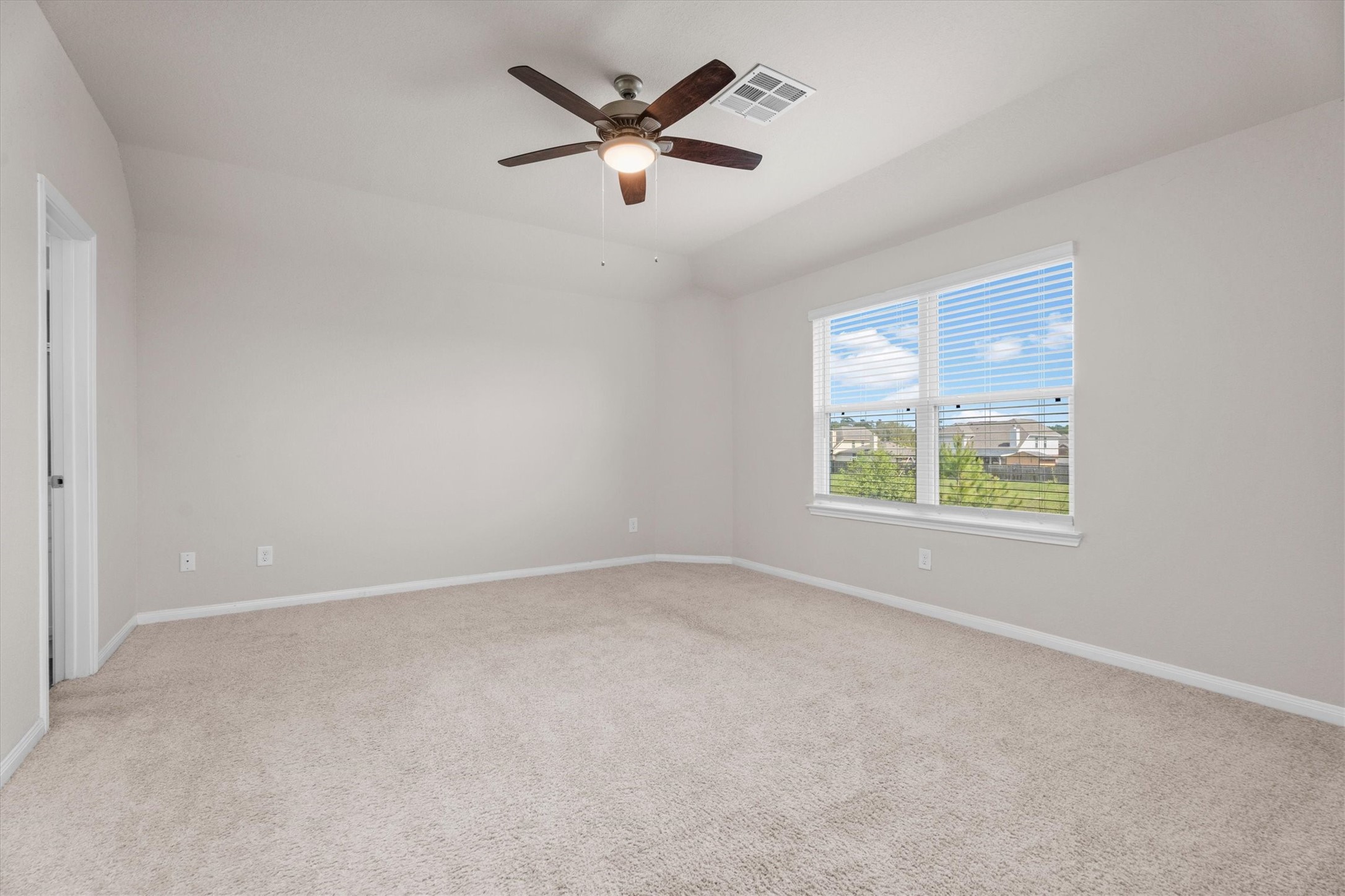 23622 Goodfellow Drive Spring, TX 77373 - Photo 19 of 34 an empty room with ceiling fan and windows