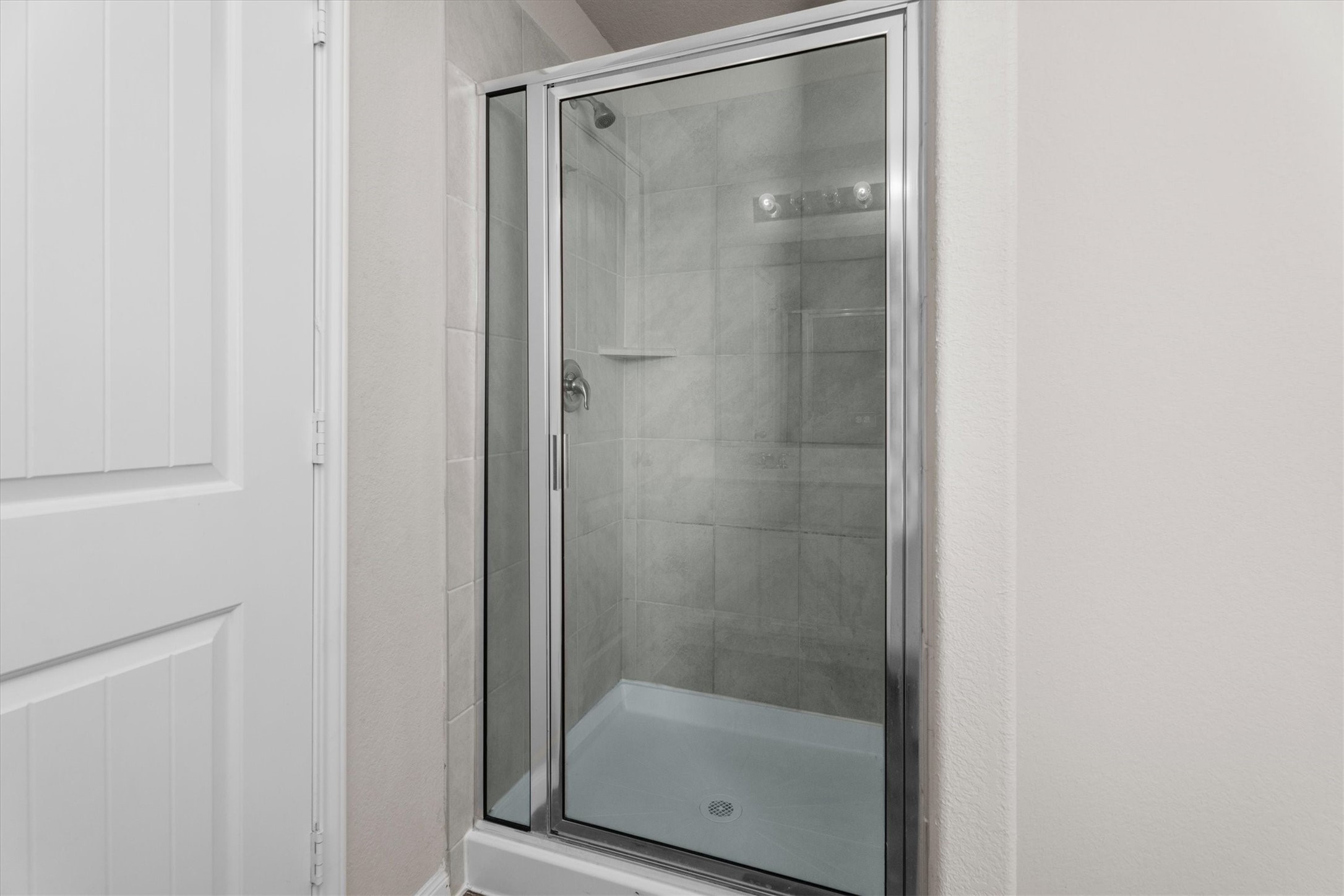 23622 Goodfellow Drive Spring, TX 77373 - Photo 21 of 34 a bathroom with a glass shower door