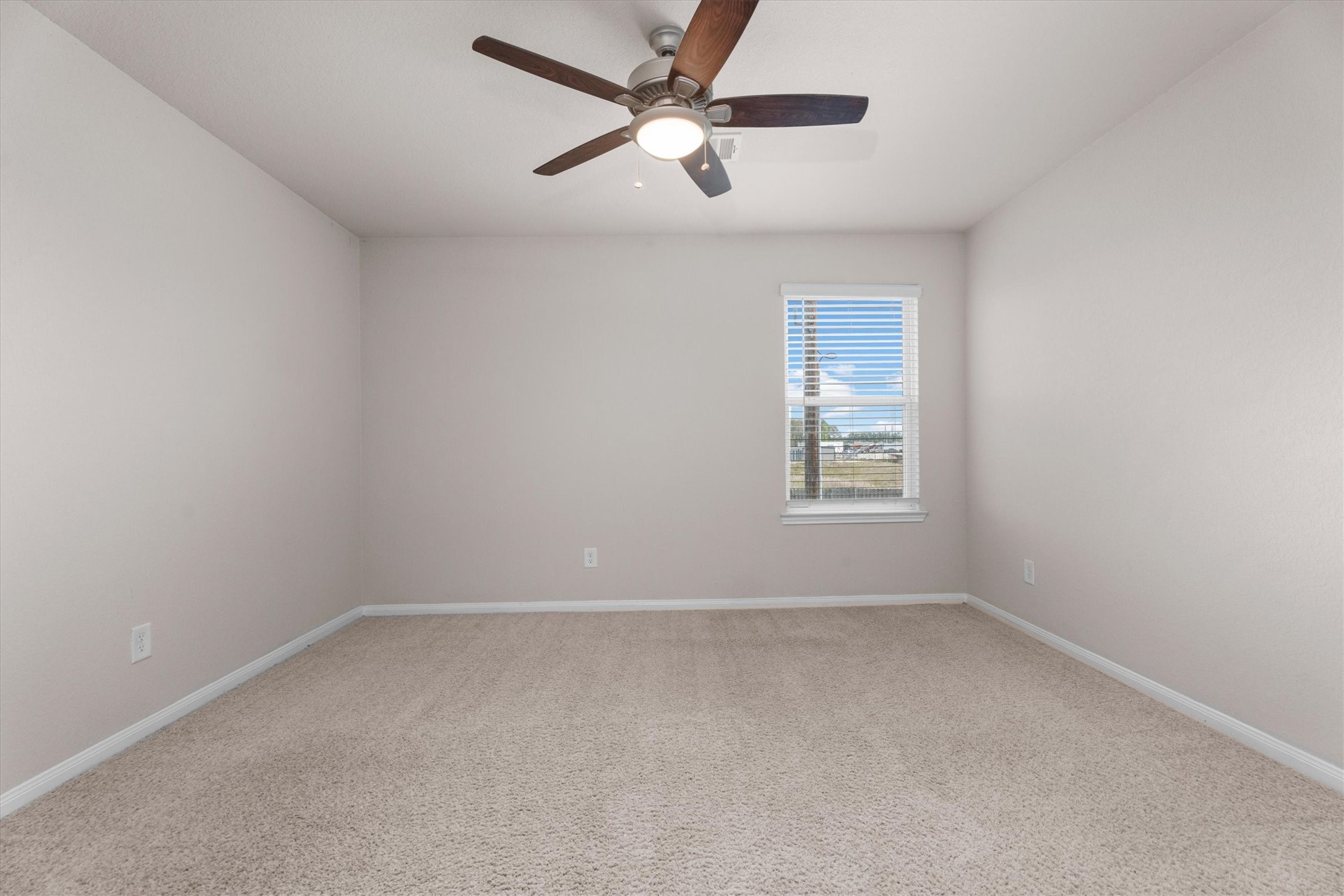 23622 Goodfellow Drive Spring, TX 77373 - Photo 25 of 34 an empty room with a window and a fan