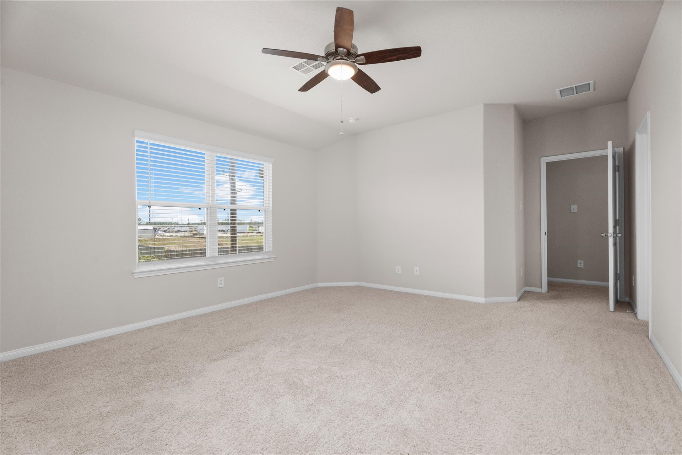 23622 Goodfellow Drive Spring, TX 77373 - Photo 27 of 34 an empty room with windows and fan