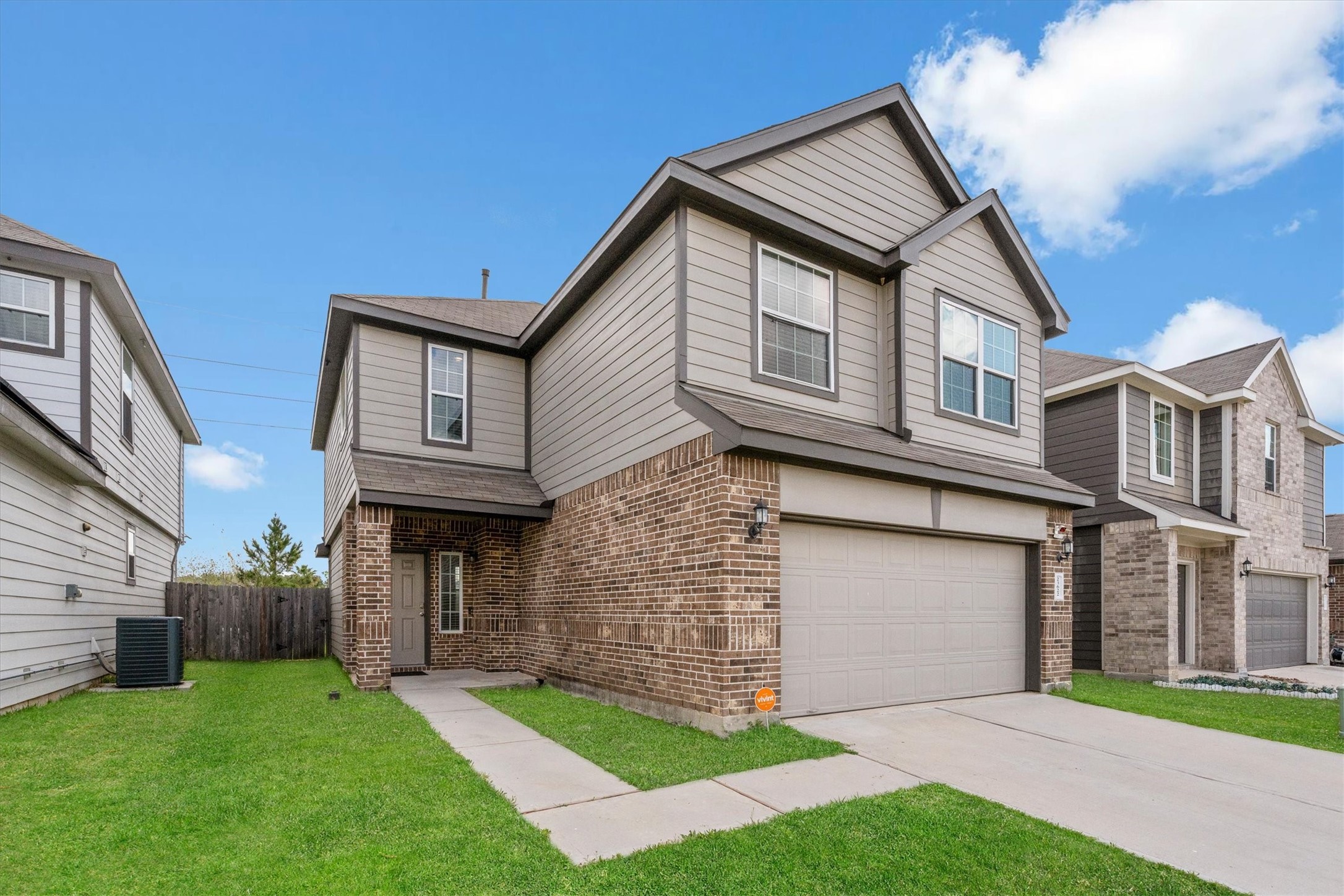 23622 Goodfellow Drive Spring, TX 77373 - Photo 3 of 34 a front view of a house with a yard and garage