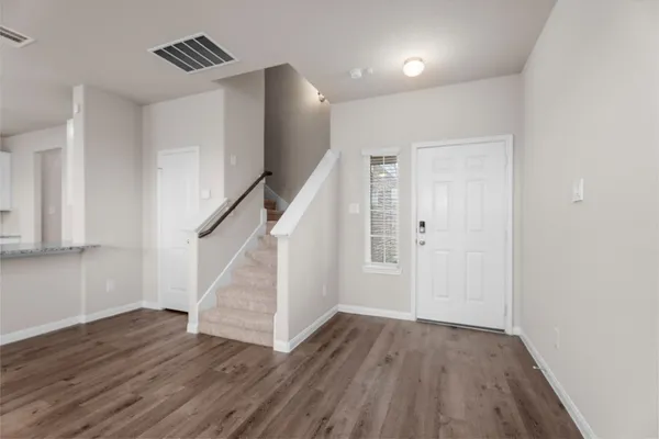 a view of entryway with wooden floor