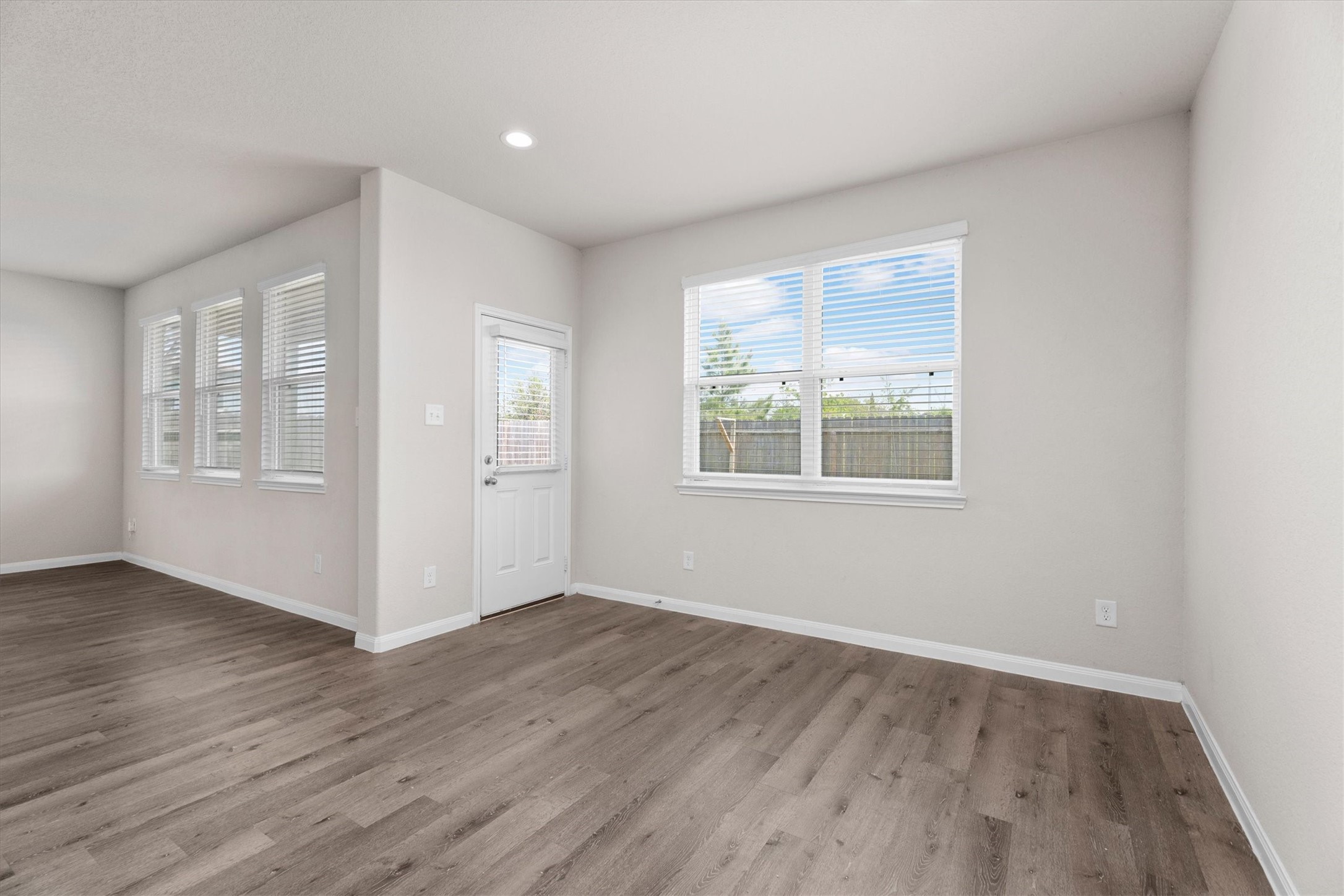 23622 Goodfellow Drive Spring, TX 77373 - Photo 8 of 34 an empty room with wooden floor and windows