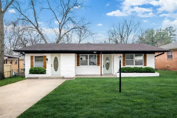 a view of a house with a garden