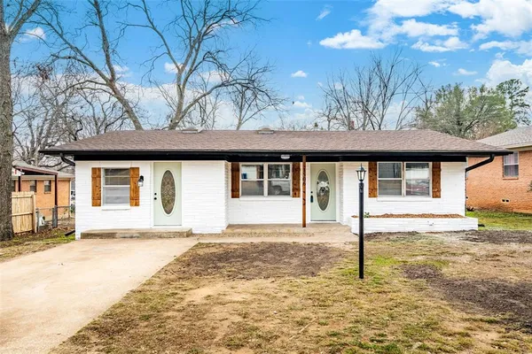 a house with yard in front of it