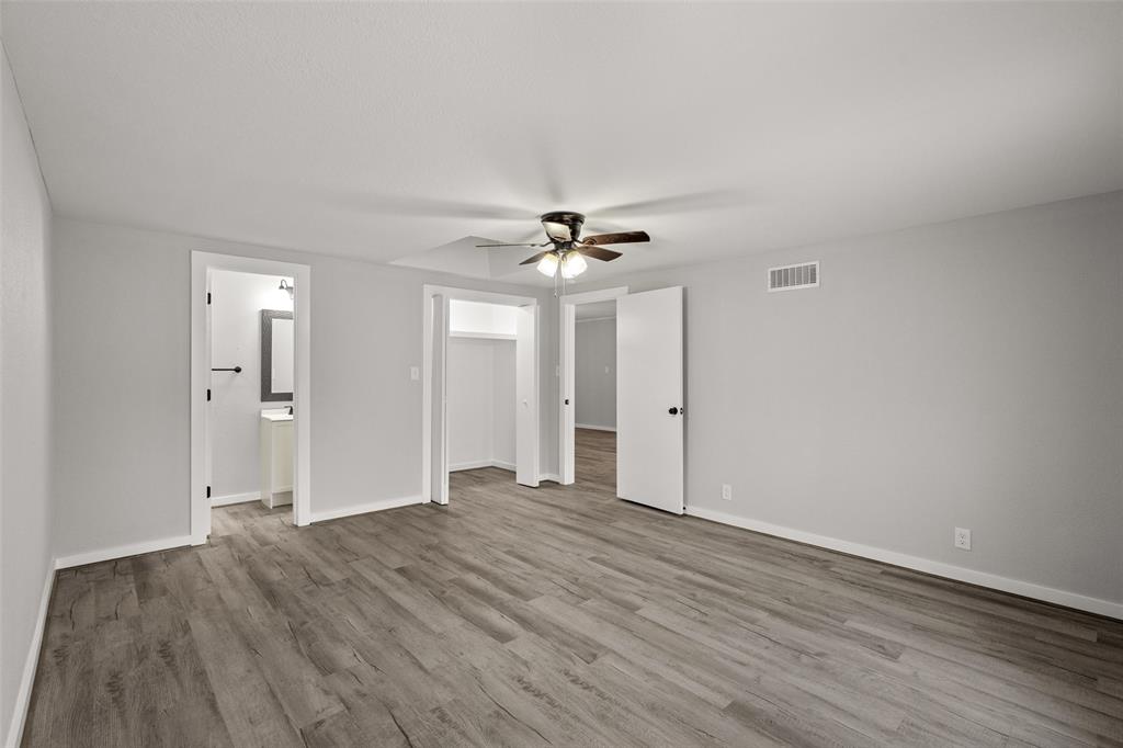1506 West Main Street Denison, TX 75020 - Photo 26 of 38 a view of a livingroom with a ceiling fan window and wooden floor