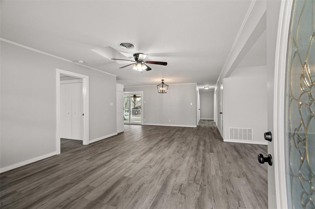 1506 West Main Street Denison, TX 75020 - Photo 32 of 38 wooden floor in an empty room with a window