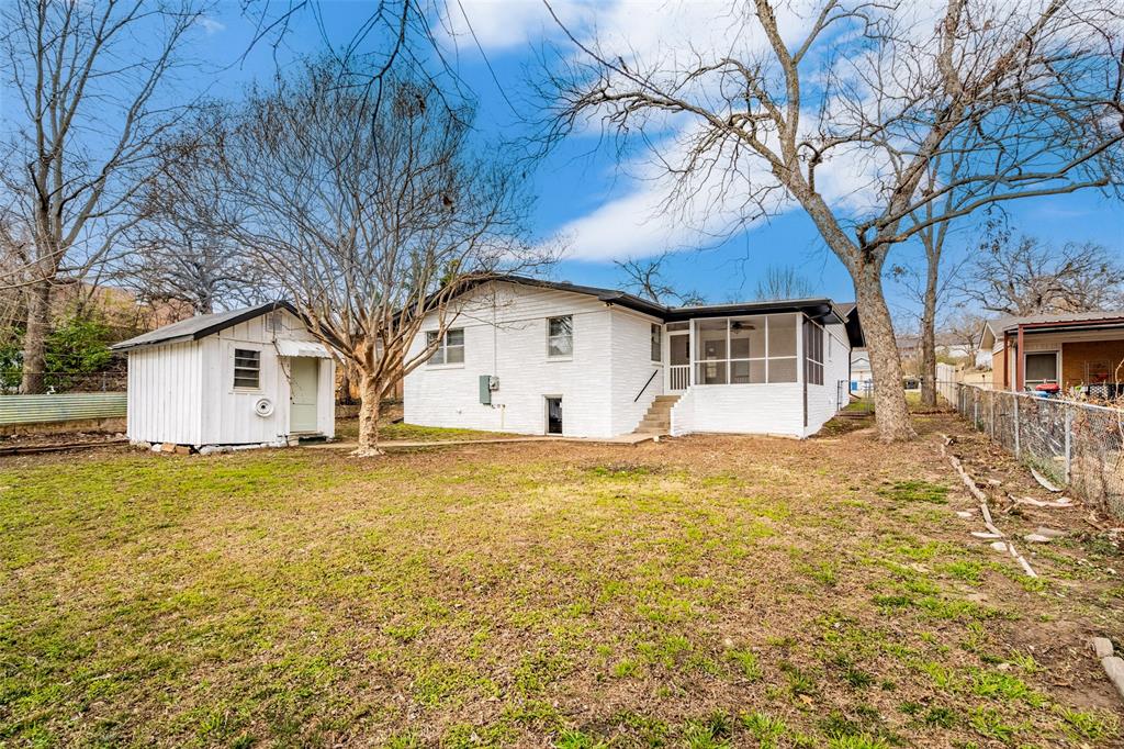 1506 West Main Street Denison, TX 75020 - Photo 33 of 38 a front view of a house with yard