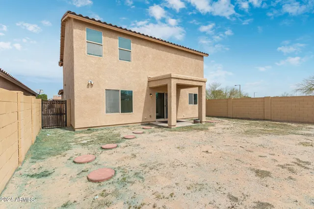 a view of a house with a snow in the yard