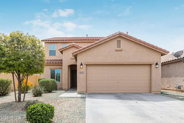 a view of a house with a street