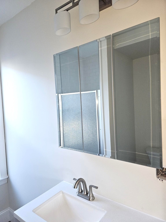 323 Chatham Street, Unit 3 Lynn, MA 01902 - Photo 11 of 13 a bathroom with a tub and a sink