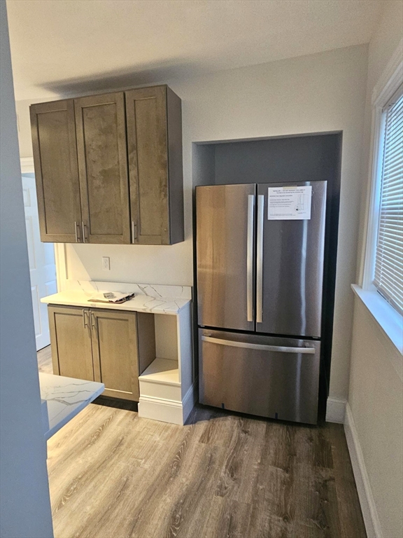 323 Chatham Street, Unit 3 Lynn, MA 01902 - Photo 6 of 13 a kitchen with a refrigerator and a sink