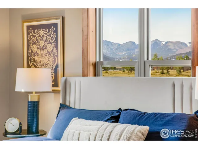 a bathroom with double vanity sinks and a mirror