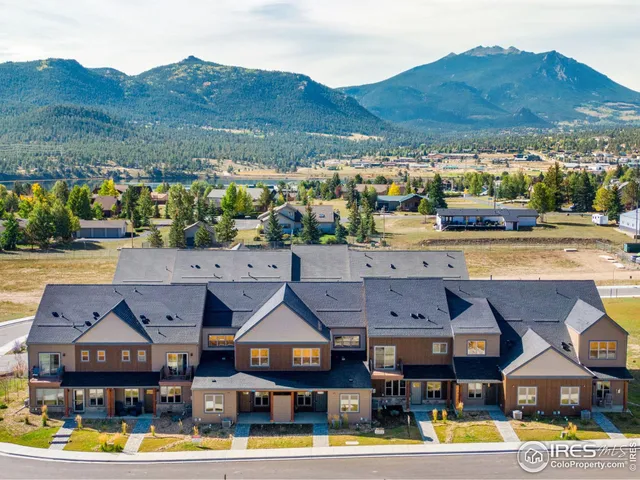 a view of a house with pool and chairs