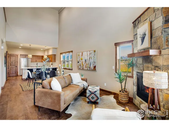 a living room with furniture and a lamp