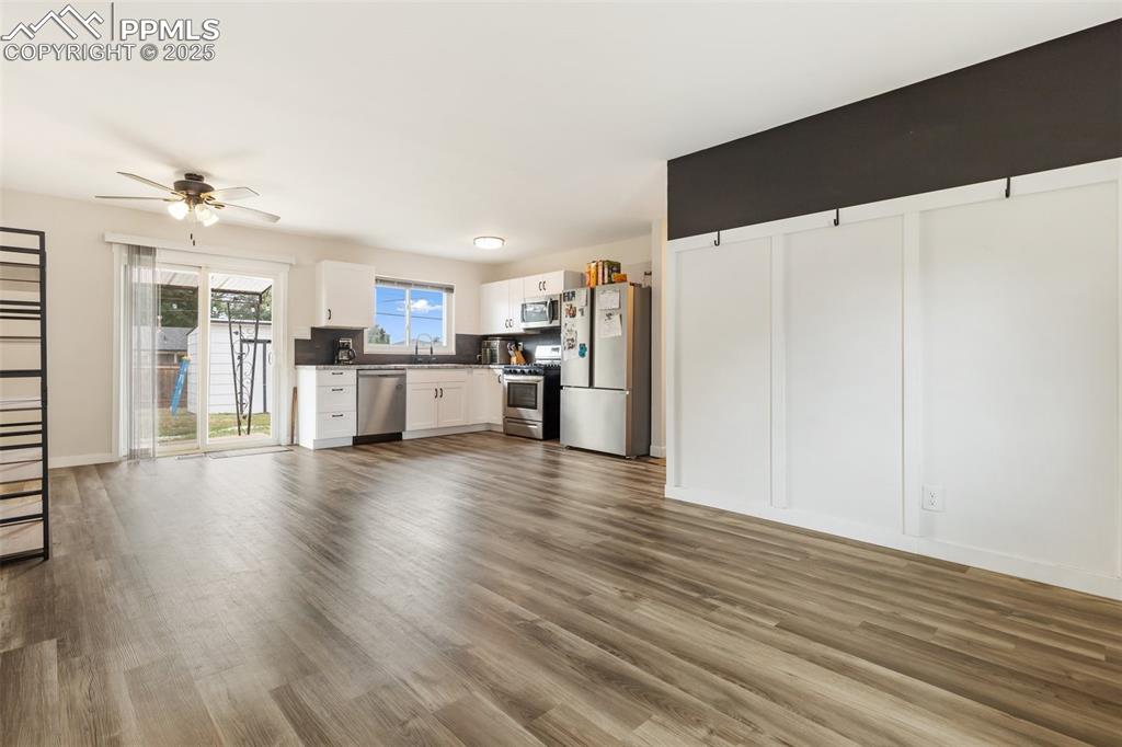 509 Inca Drive Colorado Springs, CO 80911 - Photo 11 of 30 a view of a kitchen with a refrigerator and a stove top oven