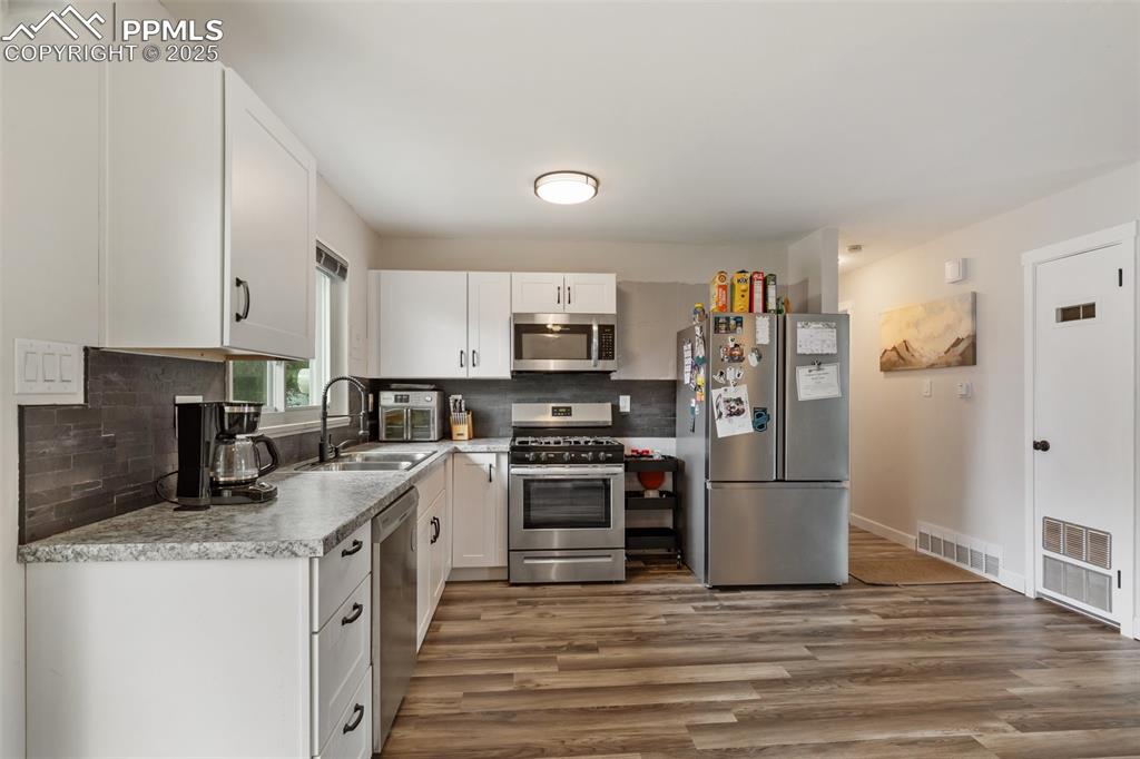 509 Inca Drive Colorado Springs, CO 80911 - Photo 13 of 30 a kitchen with a sink and steel appliances