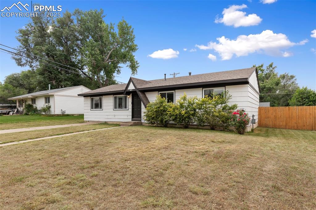 509 Inca Drive Colorado Springs, CO 80911 - Photo 2 of 30 a front view of a house with a garden