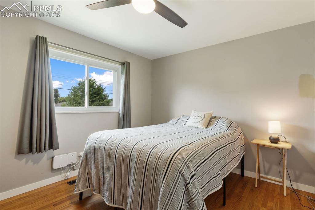 509 Inca Drive Colorado Springs, CO 80911 - Photo 22 of 30 a bedroom with a bed and a window