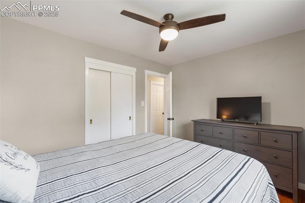 509 Inca Drive Colorado Springs, CO 80911 - Photo 23 of 30 a bedroom with a bed and a flat screen tv