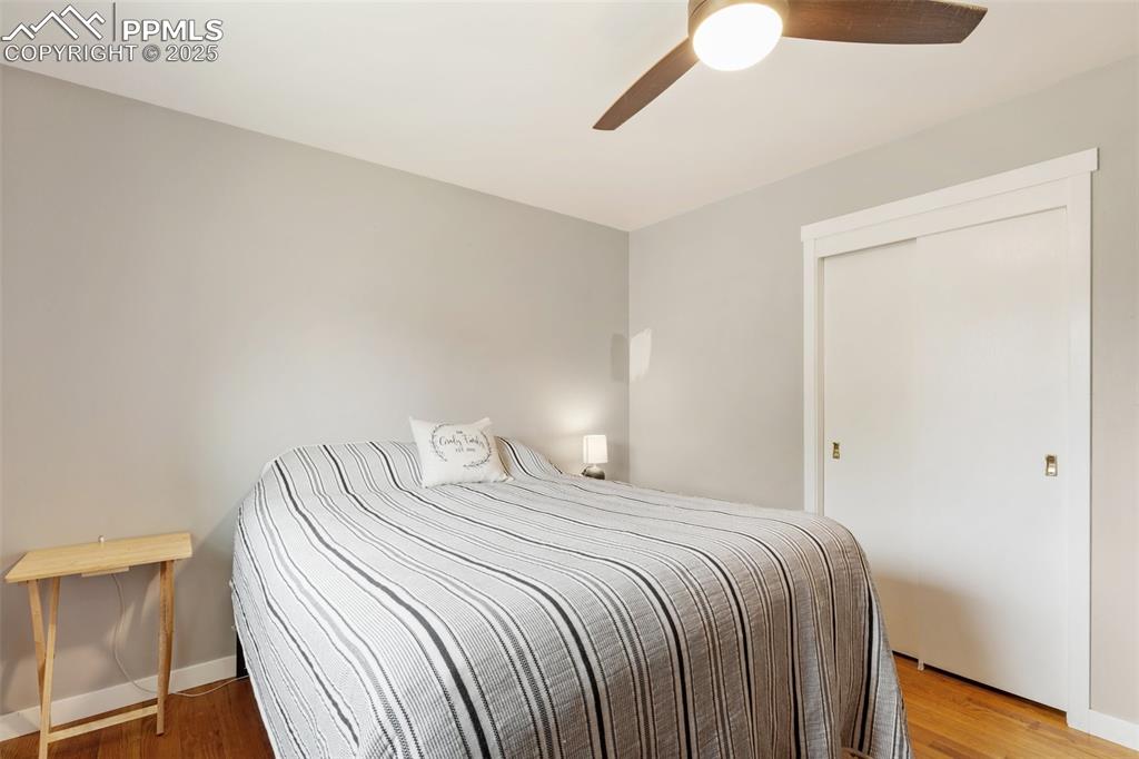 509 Inca Drive Colorado Springs, CO 80911 - Photo 24 of 30 a bedroom with a bed and a potted plant