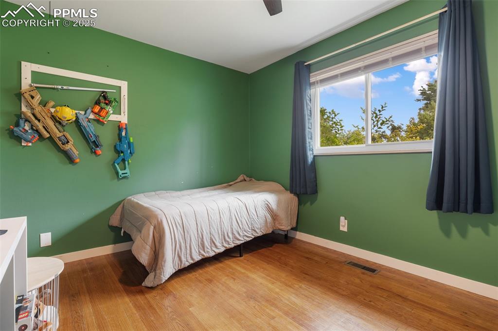 509 Inca Drive Colorado Springs, CO 80911 - Photo 25 of 30 a bedroom with a bed and a window