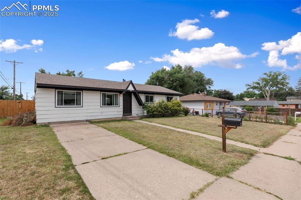 509 Inca Drive Colorado Springs, CO 80911 - Photo 5 of 30 a front view of a house with garden