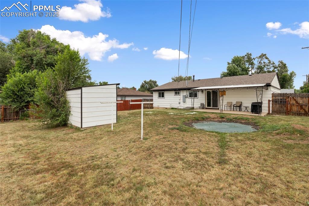 509 Inca Drive Colorado Springs, CO 80911 - Photo 6 of 30 a front view of a house with a yard table and chairs