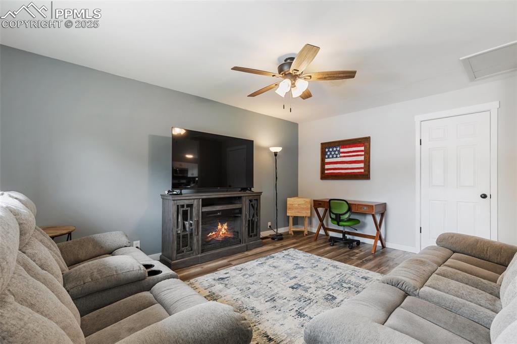 509 Inca Drive Colorado Springs, CO 80911 - Photo 8 of 30 a living room with furniture and a flat screen tv