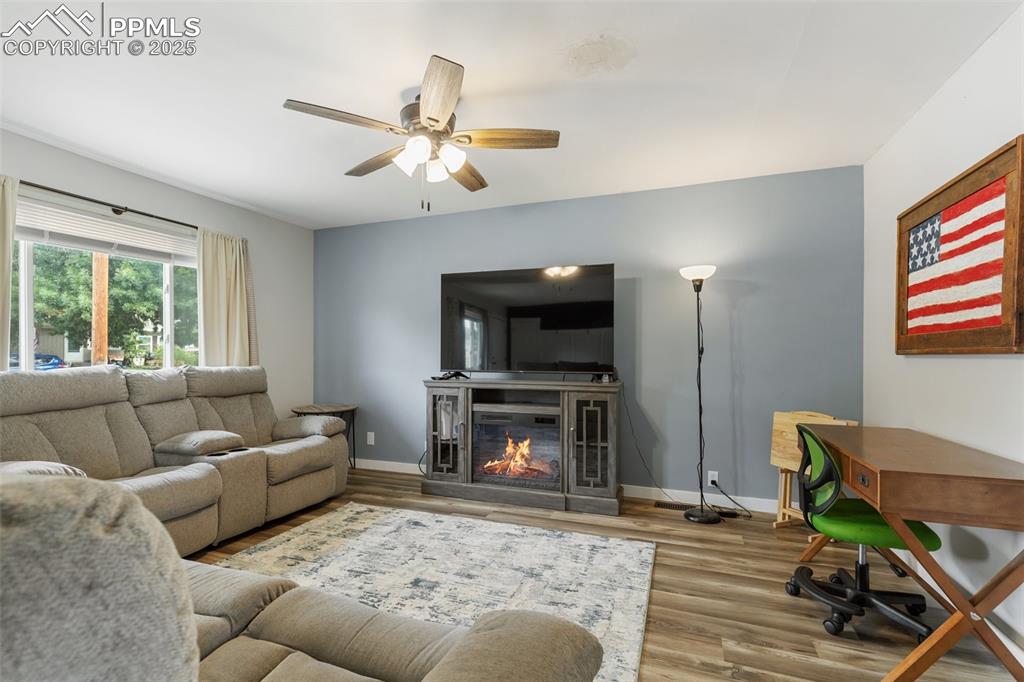 509 Inca Drive Colorado Springs, CO 80911 - Photo 9 of 30 a living room with furniture and a fireplace